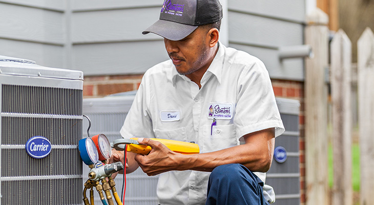 Blanton's service professional checking a home's AC during an appointment