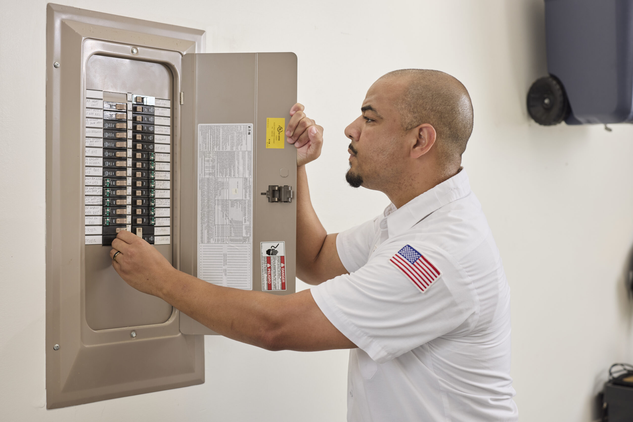 Blanton's tech servicing a breaker panel
