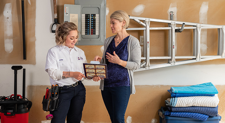 Blanton's service professional speaking with a homeowner about their electrical system