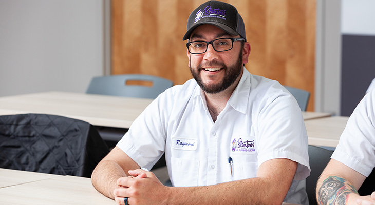Close-up of a smiling Blanton's employee.