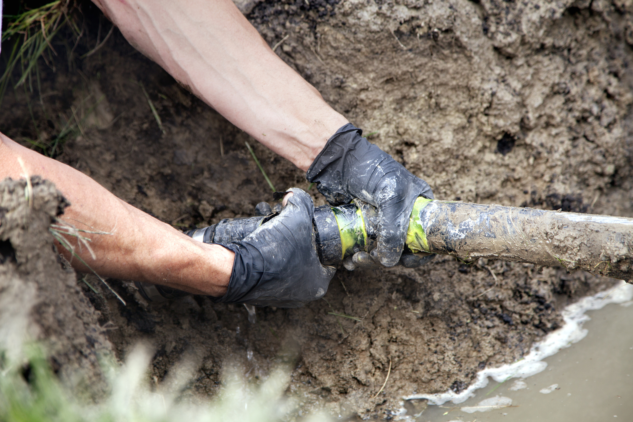 Plumber repairing a residential sewer line