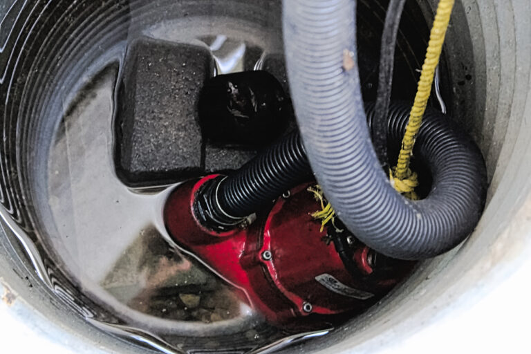 A sewage ejector pump with some water around it